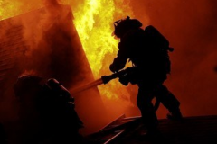 Firefighter-Spraying-into-Fire